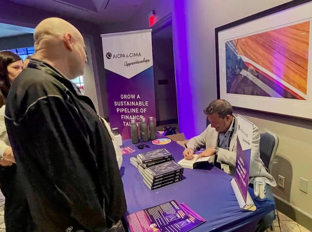 Glenn Hopper signing books at the AICPA Future Finance event